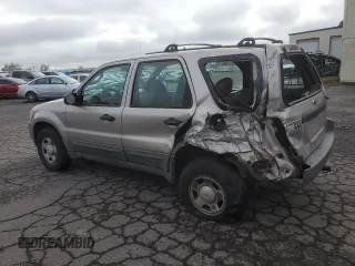 2001 Ford Escape XLS with VIN 1FMYU02111KA37010, listed as a Copart auction lot 52328415 with 312,425 mi miles and Salvage title. Bid and sale history available at DreamBid. Image 2.