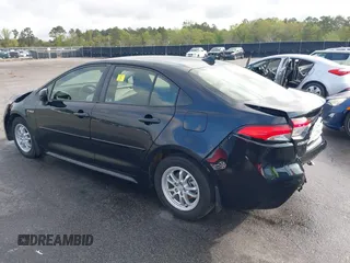 2021 Toyota Corolla Hybrid LE with VIN JTDEAMDE3MJ025426, listed as a IAAI auction lot 41922582 with 57,705 mi miles. Bid and sale history available at carsss.com. Image 3.