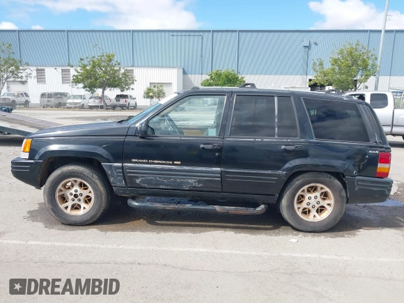 1996 Jeep Grand Cherokee Limited z VIN 1J4GZ78Y3TC191000, wystawiony jako IAAI lot #42259621 z przebiegiem 212 690 mil mil oraz . Historia ofert i sprzedaży dostępna na DreamBid. Obrazek 14.