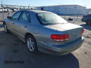 2002 Mazda Millenia z VIN JM1TA221021739118, wystawiony jako IAAI lot #41268546 z przebiegiem 182 463 mil mil oraz . Historia ofert i sprzedaży dostępna na DreamBid. Obrazek 3.