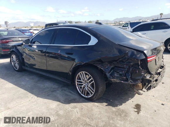 2024 BMW 5 Series 530i with VIN WBA43FJ08RCP78906, listed as a Copart auction lot 50730475 with 29,442 mi miles and Salvage title. Bid and sale history available at DreamBid. Image 2.