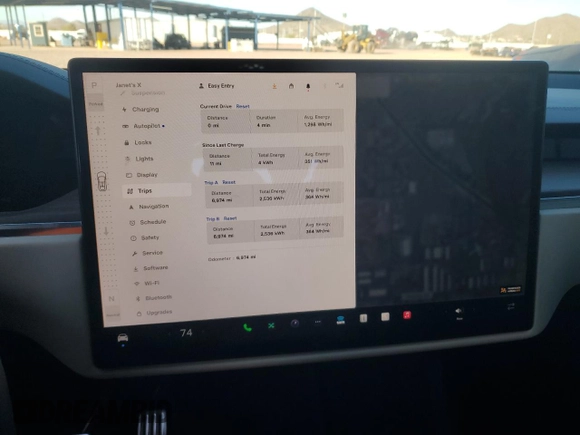2023 Tesla Model X with VIN 7SAXCAE5XPF384061, listed as a Copart auction lot 86834084 with 6,974 mi miles and Salvage Title. Bid and sale history available at DreamBid. Image 9.