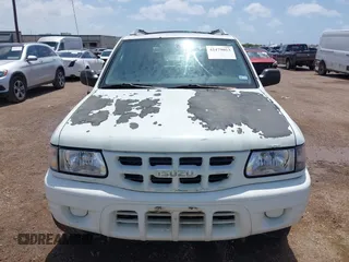 2001 Isuzu Rodeo S z VIN 4S2CK58W414357404, wystawiony jako IAAI lot #42479053 z przebiegiem Nie podano mil oraz . Historia ofert i sprzedaży dostępna na DreamBid. Obrazek 6.