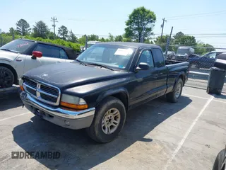 2004 Dodge Dakota SLT with VIN 1D7GL42N14S527342, listed as a IAAI auction lot 42081956 with 165,157 mi miles. Bid and sale history available at carsss.com. Image 2.