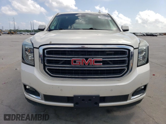 2015 GMC Yukon SLT z VIN 1GKS1BKC4FR552523, wystawiony jako Copart lot #54658135 z przebiegiem 93 907 mil mil oraz Czysty tytuł • Clean title. Historia ofert i sprzedaży dostępna na DreamBid. Obrazek 5.