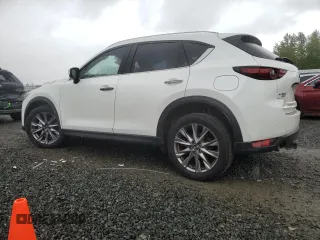 2019 Mazda CX-5 Grand Touring with VIN JM3KFBDM4K0669589, listed as a Copart auction lot 54948455 with 64,475 mi miles and Salvage Title. Bid and sale history available at carsss.com. Image 2.