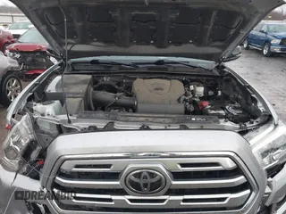 2018 Toyota Tacoma SR with VIN 5TFGZ5AN4JX142565, listed as a IAAI auction lot 41353718 with 87,544 mi miles and . Bid and sale history available at carsss.com. Image 10.