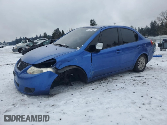 2012 Suzuki SX4 LE z VIN JS2YC5A30C6305375, wystawiony jako Copart lot #45429185 z przebiegiem 103 283 mil mil oraz Szkoda całkowita • Salvage title. Historia ofert i sprzedaży dostępna na DreamBid. Obrazek 1.
