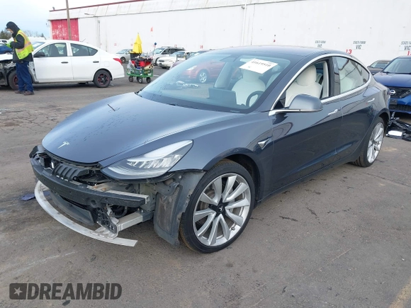 2018 Tesla Model 3 Long Range Battery with VIN 5YJ3E1EB9JF097118, listed as a IAAI auction lot 41619510 with 64,132 mi miles and . Bid and sale history available at DreamBid. Image 21.