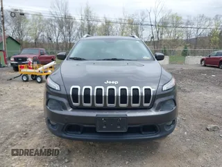2014 Jeep Cherokee Latitude with VIN 1C4PJMCS5EW201459, listed as a IAAI auction lot 42092653 with 147,430 mi miles. Bid and sale history available at carsss.com. Image 12.