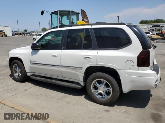 2006 GMC Envoy SLE z VIN 1GKDT13S762345183, wystawiony jako Copart lot #60096645 z przebiegiem 249 658 mil mil oraz Szkoda całkowita • Salvage title. Historia ofert i sprzedaży dostępna na DreamBid. Obrazek 2.