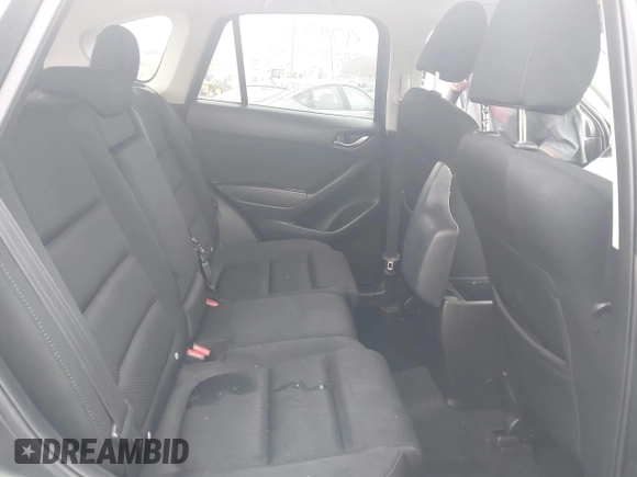 2016 Mazda CX-5 Touring with VIN JM3KE2CY7G0630056, listed as a IAAI auction lot 41817525 with 97,844 mi miles and . Bid and sale history available at DreamBid. Image 8.