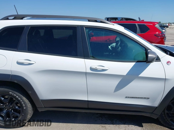 2021 Jeep Cherokee Trailhawk with VIN 1C4PJMBX1MD145169, listed as a IAAI auction lot 42340464 with 50,925 mi miles and . Bid and sale history available at DreamBid. Image 13.