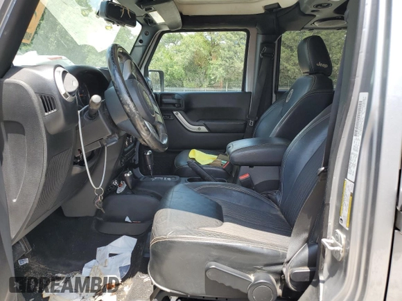 2013 Jeep Wrangler Unlimited Sport with VIN 1C4BJWDG4DL628518, listed as a Copart auction lot 65029795 with 142,852 mi miles and Salvage title. Bid and sale history available at DreamBid. Image 7.
