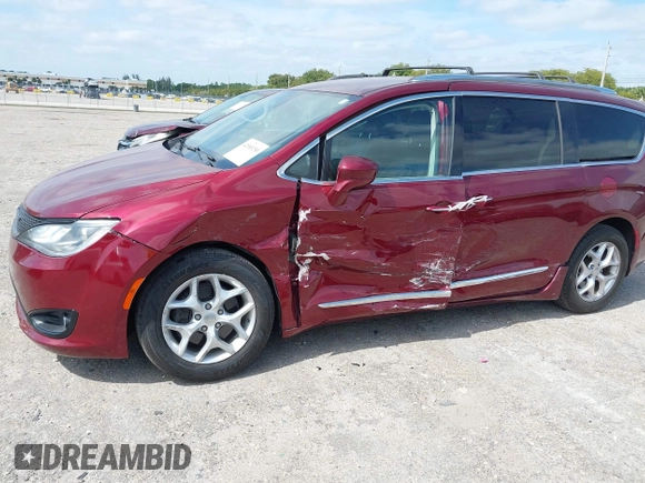 2017 Chrysler Pacifica Touring L with VIN 2C4RC1BG6HR739602, listed as a IAAI auction lot 42085250 with 96,377 mi miles and . Bid and sale history available at DreamBid. Image 6.