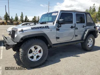 2015 Jeep Wrangler Unlimited Willys Wheeler with VIN 1C4BJWDG7FL587014, listed as a Copart auction lot 50976905 with 81,045 mi miles and Salvage Title. Bid and sale history available at DreamBid. Image 1.