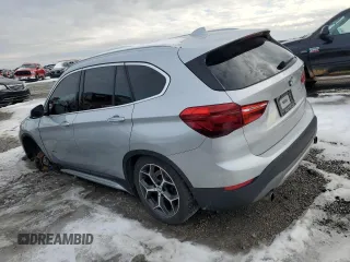 2018 BMW X1 sDrive28i with VIN WBXHU7C32J5H44215, listed as a Copart auction lot 87356474 with 121,828 mi miles and Salvage Title. Bid and sale history available at carsss.com. Image 2.