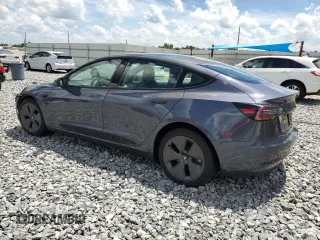 2023 Tesla Model 3 с VIN 5YJ3E1EA4PF449103, выставлен на аукционе Copart как лот 61309645 с пробегом 131 784 миль миль и Чистый • Clean title. История ставок и продаж доступна на DreamBid. Изображение 2.