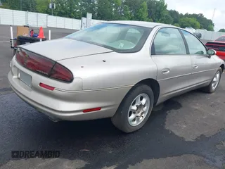 1997 Oldsmobile Aurora z VIN 1G3GR62CXV4121200, wystawiony jako IAAI lot #42277003 z przebiegiem 198 048 mil mil oraz . Historia ofert i sprzedaży dostępna na DreamBid. Obrazek 4.