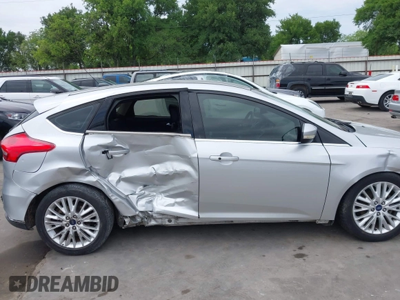 2015 Ford Focus Titanium with VIN 1FADP3N23FL356822, listed as a IAAI auction lot 41981053 with 115,584 mi miles and . Bid and sale history available at DreamBid. Image 14.