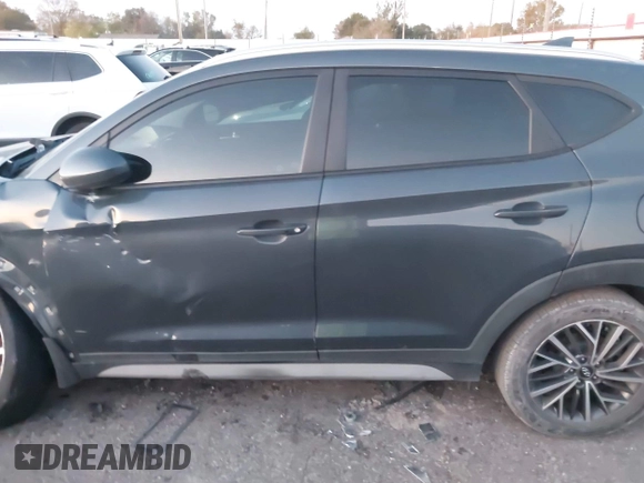 2019 Hyundai Tucson Sport with VIN KM8J33AL7KU901296, listed as a IAAI auction lot 41132884 with 76,948 mi miles. Bid and sale history available at carsss.com. Image 14.