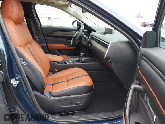2024 Mazda CX-50 2.5 Turbo with VIN 7MMVABXY1RN237106, listed as a IAAI auction lot 42117311 with 3,135 mi miles and . Bid and sale history available at DreamBid. Image 5.