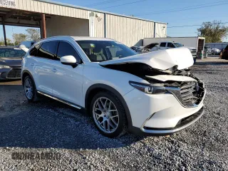 2017 Mazda CX-9 Grand Touring z VIN JM3TCADYXH0127867, wystawiony jako Copart lot #82352204 z przebiegiem 129 349 mil mil oraz Szkoda całkowita • Salvage title. Historia ofert i sprzedaży dostępna na DreamBid. Obrazek 4.