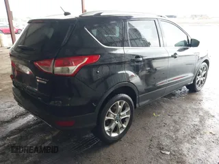 2014 Ford Escape Titanium z VIN 1FMCU0J96EUA84108, wystawiony jako IAAI lot #42114002 z przebiegiem 176 735 mil mil oraz . Historia ofert i sprzedaży dostępna na DreamBid. Obrazek 4.