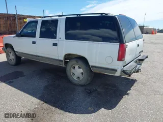 1996 Chevrolet Suburban with VIN 1GNFK16R9TJ411712, listed as a IAAI auction lot 42070739 with 242,044 mi miles. Bid and sale history available at carsss.com. Image 3.