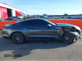 2015 Ford Mustang EcoBoost z VIN 1FA6P8TH7F5351477, wystawiony jako IAAI lot #41378347 z przebiegiem 104 755 mil mil oraz . Historia ofert i sprzedaży dostępna na DreamBid. Obrazek 13.