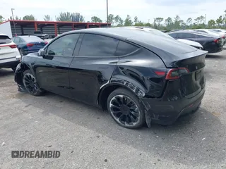 2023 Tesla Model Y Long Range with VIN 7SAYGAEE8PF928923, listed as a IAAI auction lot 41880988 with 18,468 mi miles. Bid and sale history available at carsss.com. Image 6.