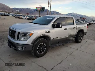 2017 Nissan Titan SL z VIN 1N6AA1E51HN530310, wystawiony jako Copart lot #81959894 z przebiegiem 62 706 mil mil oraz Szkoda całkowita • Salvage title. Historia ofert i sprzedaży dostępna na DreamBid. Obrazek 1.