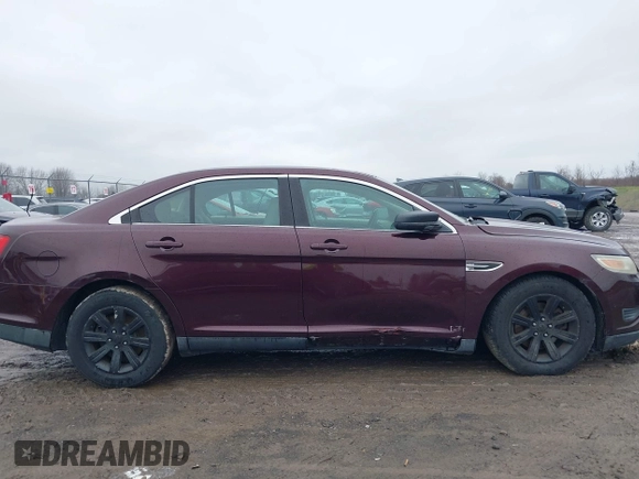 2011 Ford Taurus SE with VIN 1FAHP2DW7BG136988, listed as a IAAI auction lot 42002512 with 145,847 mi miles. Bid and sale history available at carsss.com. Image 6.