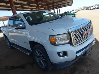 2018 GMC Canyon 4WD Denali z VIN 1GTP6EE11J1178961, wystawiony jako IAAI lot #42499884 z przebiegiem 71 309 mil mil oraz . Historia ofert i sprzedaży dostępna na DreamBid. Obrazek 1.