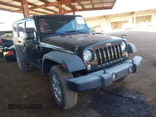 2018 Jeep Wrangler JK Unlimited Sport S with VIN 1C4BJWDG4JL883990, listed as a IAAI auction lot 41677364 with 112,389 mi miles. Bid and sale history available at carsss.com. Image 1.