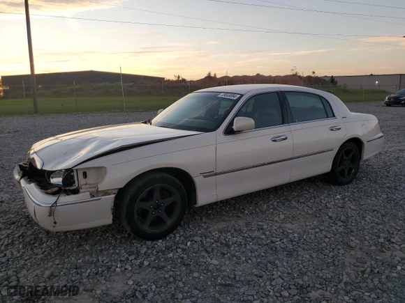 1999 Lincoln Town Car Signature with VIN 1LNHM82W4XY611874, listed as a Copart auction lot 73653694 with 182,791 mi miles and Salvage Title. Bid and sale history available at carsss.com. Image 1.