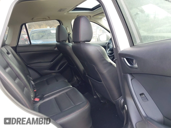 2014 Mazda CX-5 Grand Touring with VIN JM3KE4DY9E0300491, listed as a IAAI auction lot 41657153 with 157,394 mi miles and . Bid and sale history available at DreamBid. Image 8.