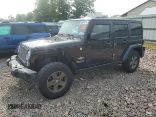2015 Jeep Wrangler Unlimited Freedom with VIN 1C4BJWDG4FL568601, listed as a Copart auction lot 64041415 with 128,874 mi miles and Salvage title. Bid and sale history available at DreamBid. Image 1.
