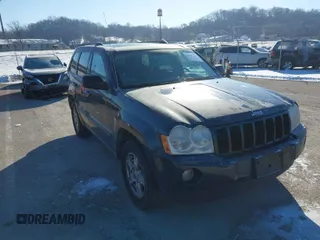 2007 Jeep Grand Cherokee Laredo with VIN 1J8GS48K97C538509, listed as a IAAI auction lot 41605236 with 164,530 mi miles. Bid and sale history available at carsss.com. Image 1.