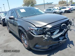 2017 Mazda CX-9 Touring with VIN JM3TCBCY1H0131233, listed as a IAAI auction lot 42490137 with 84,216 mi miles and . Bid and sale history available at DreamBid. Image 1.