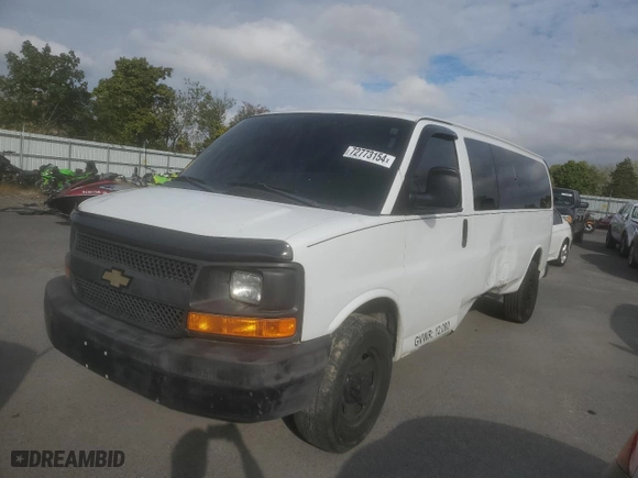2014 Chevrolet Express Passenger 1LS with VIN 1GAZGZFAXE1105162, listed as a Copart auction lot 72773154 with 97,950 mi miles and Salvage Title. Bid and sale history available at carsss.com. Image 1.