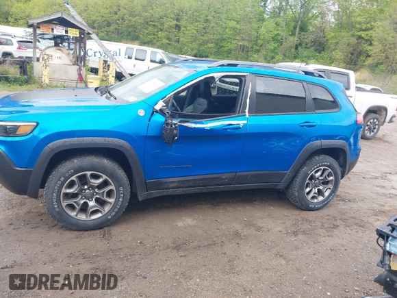 2021 Jeep Cherokee Trailhawk with VIN 1C4PJMBXXMD173102, listed as a IAAI auction lot 42205402 with 57,321 mi miles and . Bid and sale history available at DreamBid. Image 15.