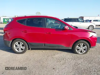 2013 Hyundai Tucson GLS with VIN KM8JU3AC6DU763590, listed as a IAAI auction lot 41999555 with 149,960 mi miles. Bid and sale history available at carsss.com. Image 13.