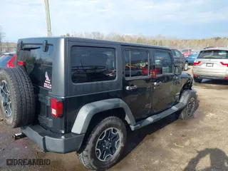 2013 Jeep Wrangler Unlimited Freedom Edition with VIN 1C4BJWDG8DL648870, listed as a IAAI auction lot 41909372 with 184,203 mi miles. Bid and sale history available at carsss.com. Image 4.