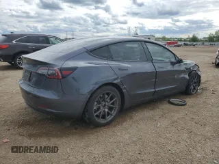2023 Tesla Model 3 with VIN 5YJ3E1EA3PF672023, listed as a Copart auction lot 57571645 with 18,115 mi miles and Salvage title. Bid and sale history available at DreamBid. Image 3.