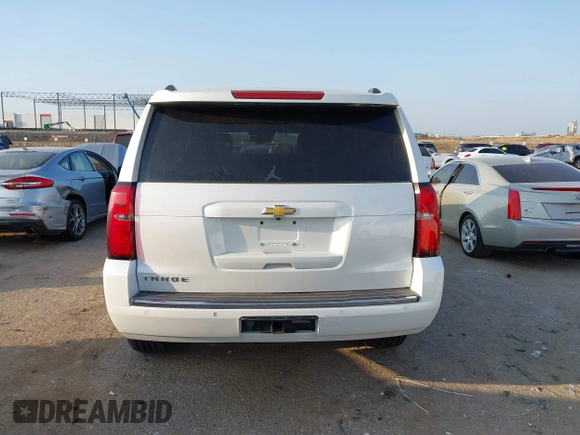 2016 Chevrolet Tahoe LTZ with VIN 1GNSKCKC9GR243895, listed as a IAAI auction lot 42322779 with 162,138 mi miles and . Bid and sale history available at DreamBid. Image 16.