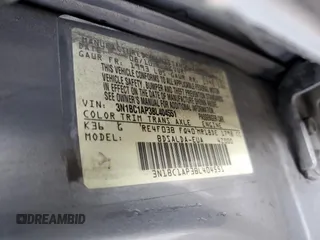 2011 Nissan Versa S with VIN 3N1BC1AP3BL404551, listed as a Copart auction lot 51977085 with 207,070 mi miles and Salvage title. Bid and sale history available at DreamBid. Image 14.