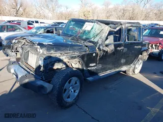 2008 Jeep Wrangler Unlimited Sahara with VIN 1J8GA59188L542812, listed as a IAAI auction lot 41229952 with 127,889 mi miles. Bid and sale history available at carsss.com. Image 18.