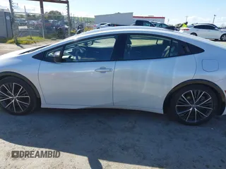 2023 Toyota Prius LE with VIN JTDACAAUXP3012538, listed as a IAAI auction lot 41948103 with 33,338 mi miles and . Bid and sale history available at DreamBid. Image 14.