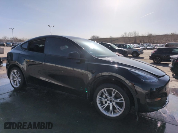 2023 Tesla Model Y Long Range with VIN 7SAYGDEE5PF850358, listed as a Copart auction lot 52581615 with 19,376 mi miles and Salvage Title. Bid and sale history available at DreamBid. Image 4.